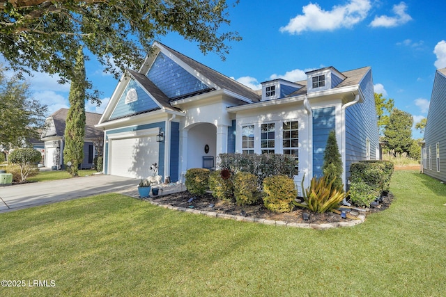 view of front of house featuring a garage and a front yard