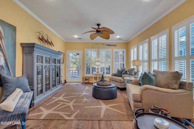 sunroom / solarium featuring visible vents and a ceiling fan