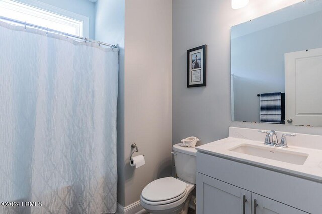 bathroom with vanity and toilet