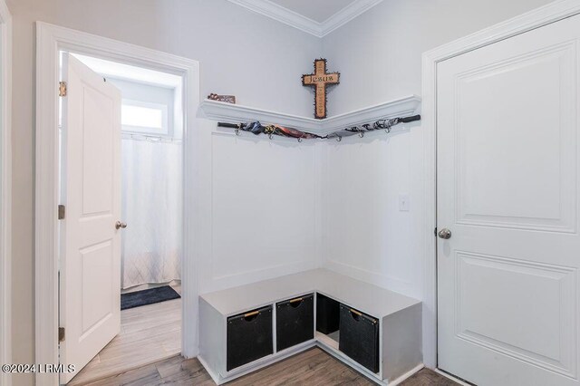 mudroom featuring hardwood / wood-style flooring and crown molding