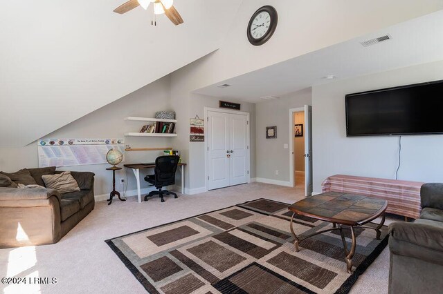 carpeted living room featuring lofted ceiling and ceiling fan