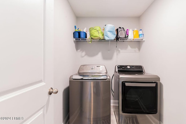 washroom with washing machine and dryer