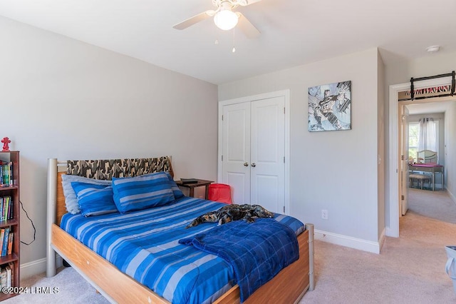 bedroom featuring a closet, ceiling fan, and carpet