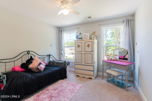 carpeted bedroom featuring ceiling fan