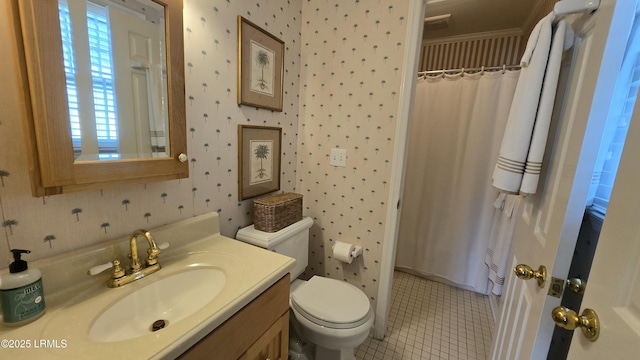 bathroom with tile patterned flooring, toilet, vanity, and wallpapered walls