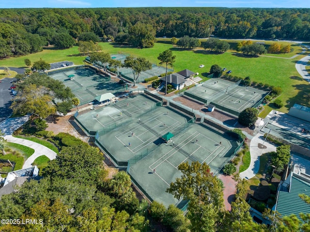 birds eye view of property featuring a view of trees