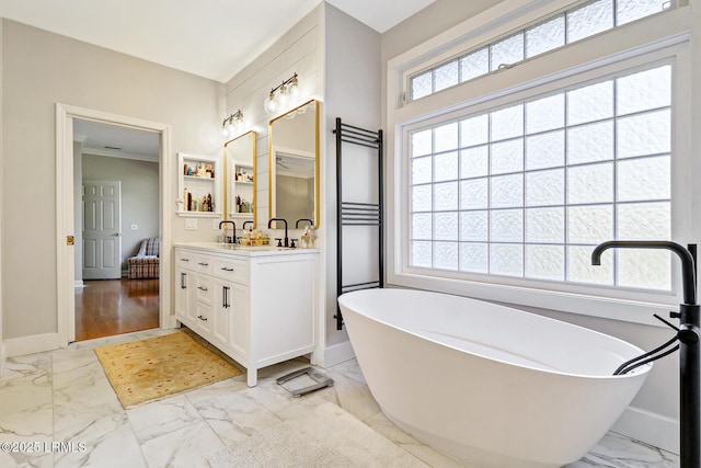 full bathroom featuring marble finish floor, a wealth of natural light, and vanity