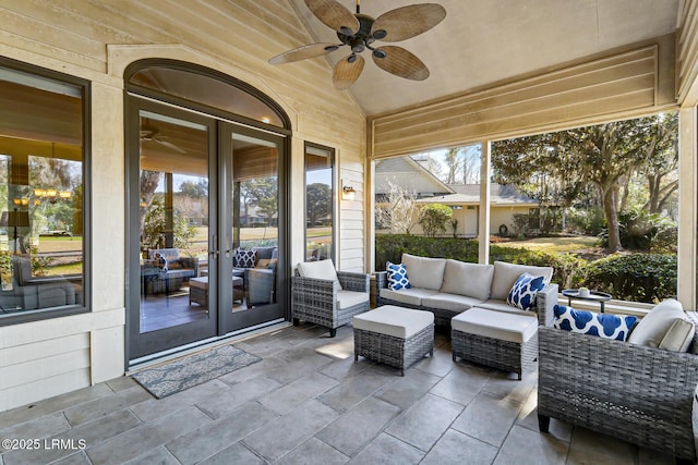 unfurnished sunroom featuring vaulted ceiling and ceiling fan