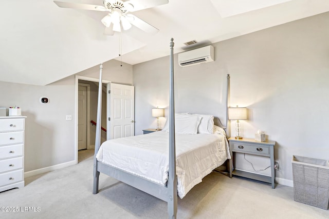 bedroom with a wall unit AC, baseboards, vaulted ceiling, and light colored carpet