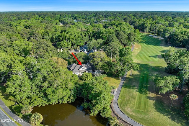 bird's eye view featuring a wooded view