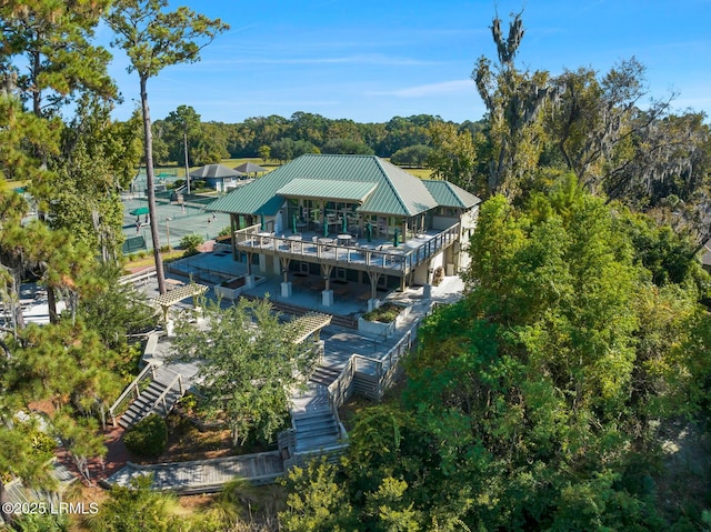 aerial view featuring a wooded view