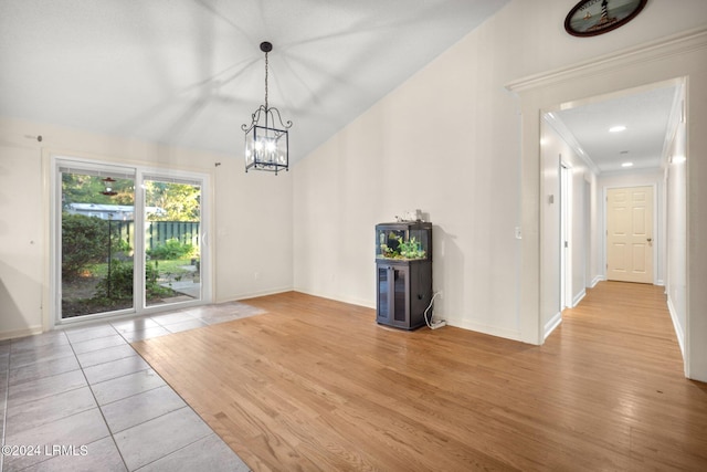 interior space with a notable chandelier and light wood-type flooring