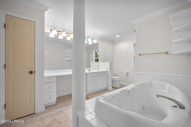 bathroom with crown molding, a bathtub, vanity, a textured ceiling, and toilet