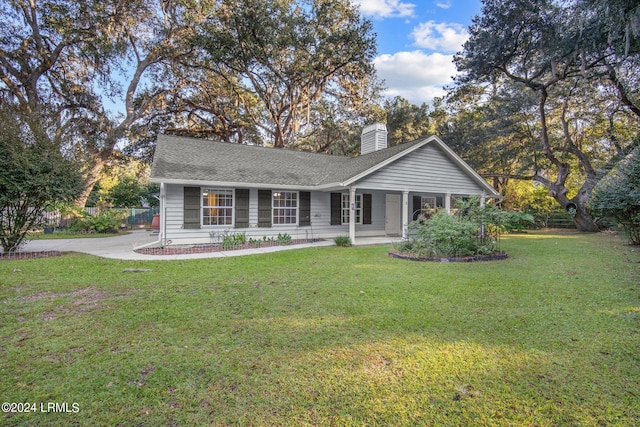 view of front of home with a front yard and a porch