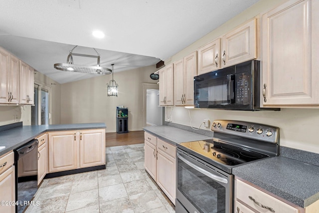 kitchen with hanging light fixtures, kitchen peninsula, and black appliances