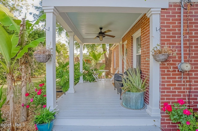 wooden terrace featuring ceiling fan