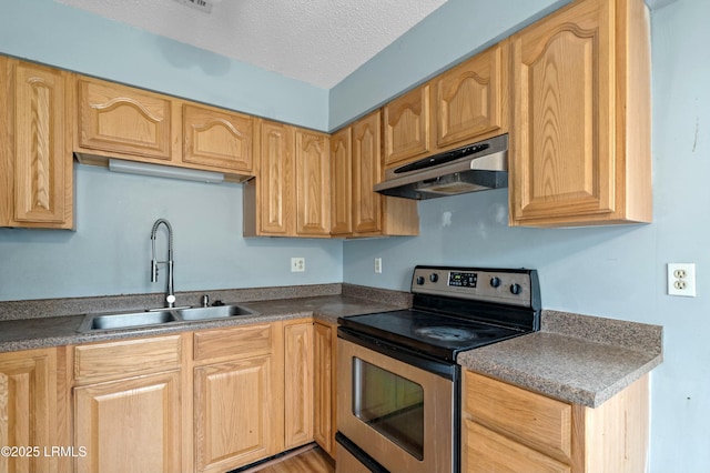 1986 Pulaski Dr, Beaufort, SC 29906 - kitchen with light brown cabinets, stainless steel electric range, a sink, under cabinet range hood, and a textured ceiling