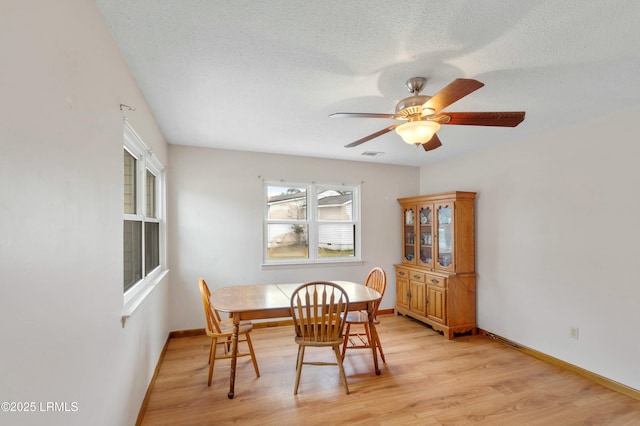 1986 Pulaski Dr, Beaufort, SC 29906 - dining area featuring visible vents, baseboards, a textured ceiling, and light wood-style flooring