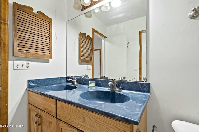 1986 Pulaski Dr, Beaufort, SC 29906 - bathroom with double vanity, toilet, and a sink