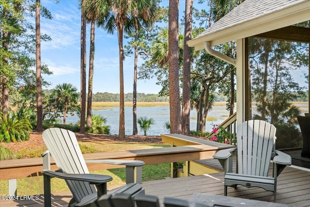 wooden deck featuring a water view