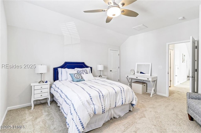 bedroom featuring light carpet, vaulted ceiling, and ceiling fan