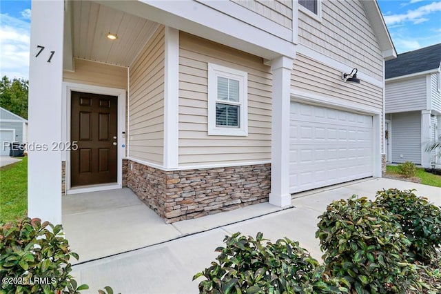 property entrance with a garage