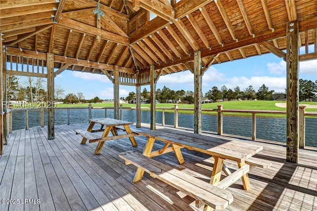 view of dock with a gazebo and a water view