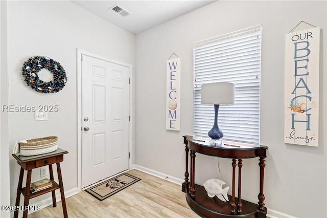 foyer with light hardwood / wood-style flooring