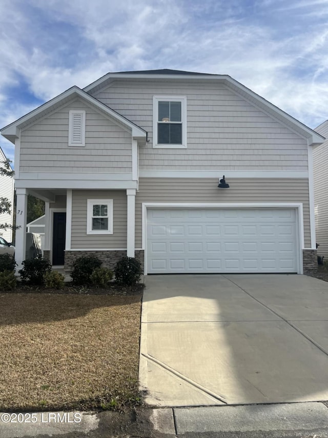 view of front of property featuring a garage