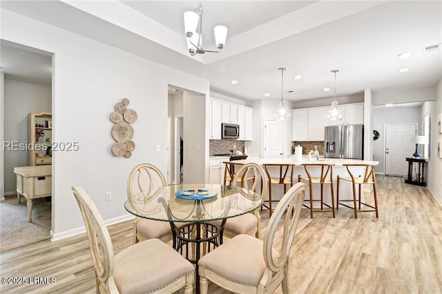 dining area featuring light hardwood / wood-style flooring