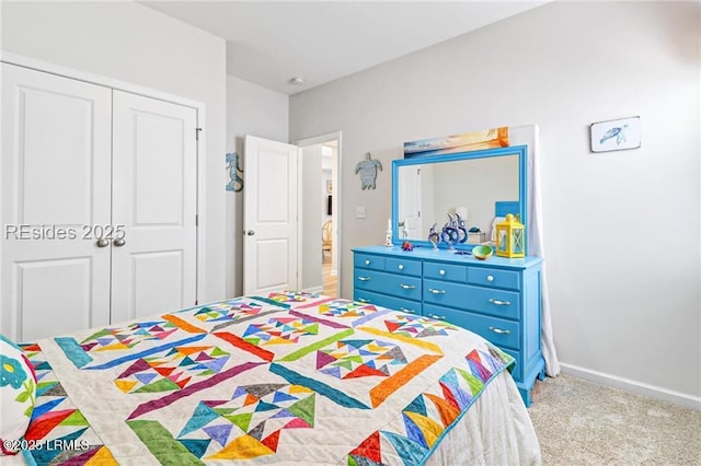 bedroom with light colored carpet and a closet