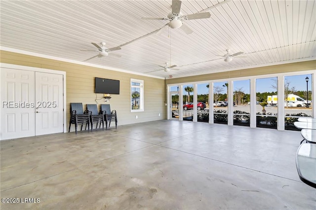 garage featuring wood walls