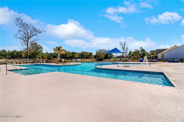 view of swimming pool featuring a patio