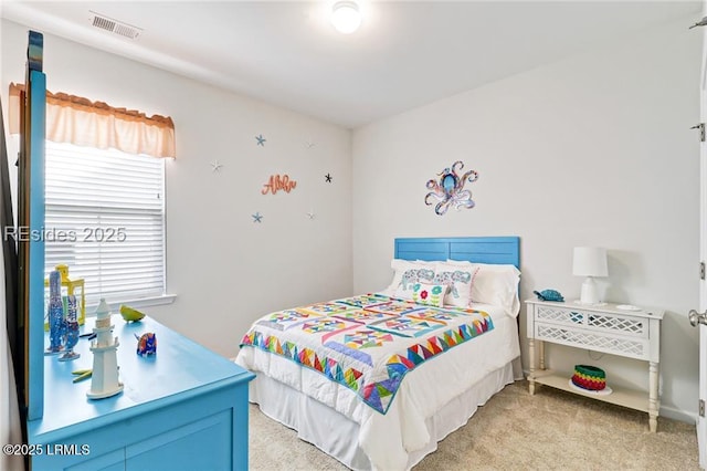 bedroom featuring light colored carpet