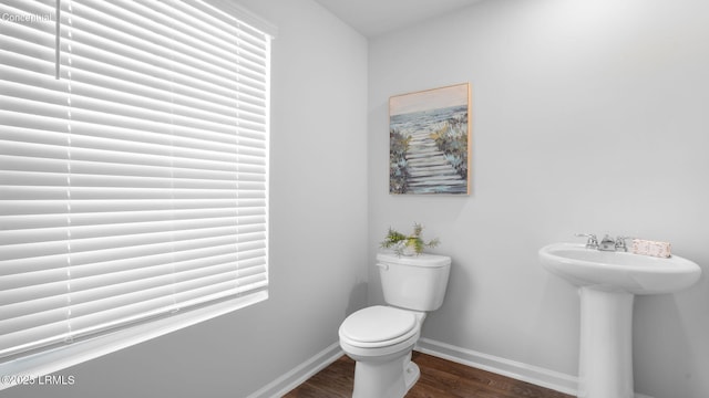 1444 Sanctum St, Ridgeland, SC 29936 - bathroom featuring toilet, wood finished floors, baseboards, and a sink