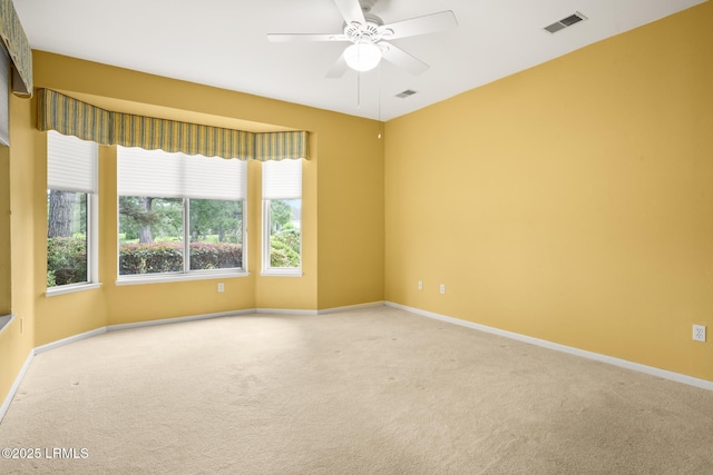7 Fenwick Dr, Bluffton, SC 29909 - empty room featuring carpet flooring, a ceiling fan, healthy amount of natural light, and baseboards
