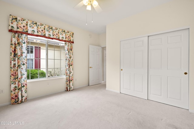 7 Fenwick Dr, Bluffton, SC 29909 - unfurnished bedroom with carpet floors, baseboards, a closet, and a ceiling fan