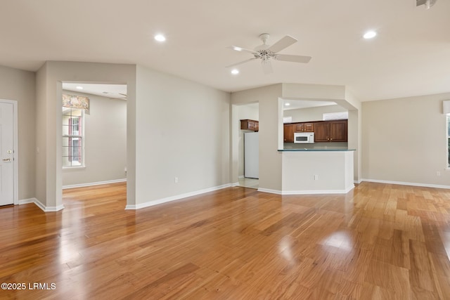 7 Fenwick Dr, Bluffton, SC 29909 - unfurnished living room featuring recessed lighting, a ceiling fan, light wood finished floors, and baseboards