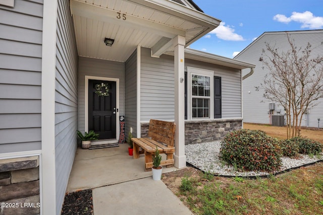 entrance to property featuring stone siding