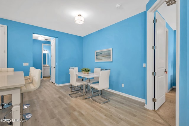 39 Island Breeze Ln Unit 102, Hardeeville, SC 29927 - dining room featuring wood finished floors and baseboards