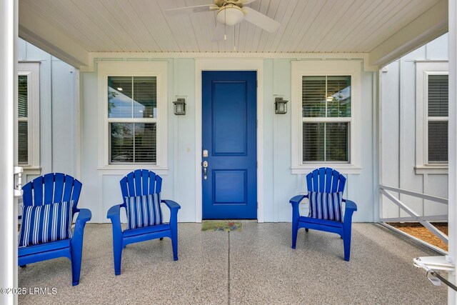 39 Island Breeze Ln Unit 102, Hardeeville, SC 29927 - doorway to property with a ceiling fan, board and batten siding, and a porch