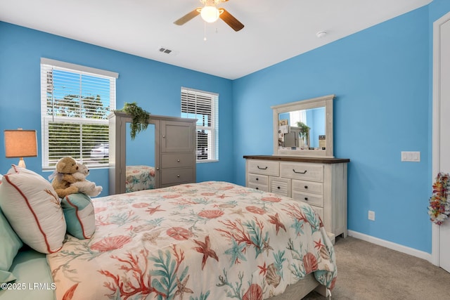 39 Island Breeze Ln Unit 102, Hardeeville, SC 29927 - carpeted bedroom featuring baseboards and ceiling fan