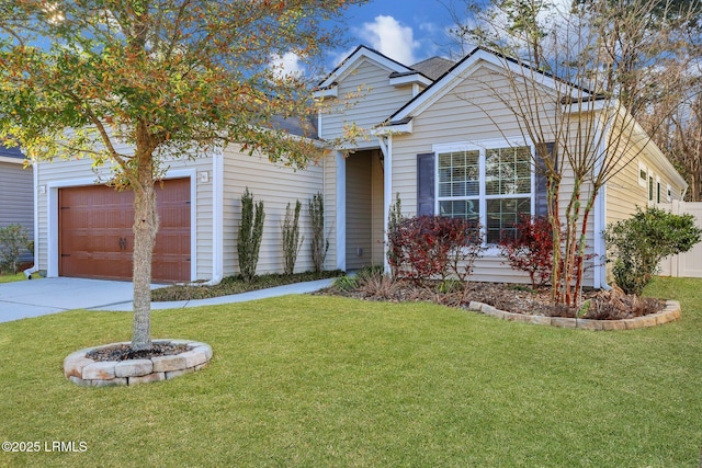 view of front of property with concrete driveway, a garage, and a front yard