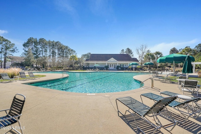 community pool with a patio area