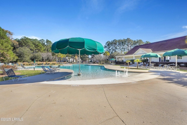 community pool featuring a patio area