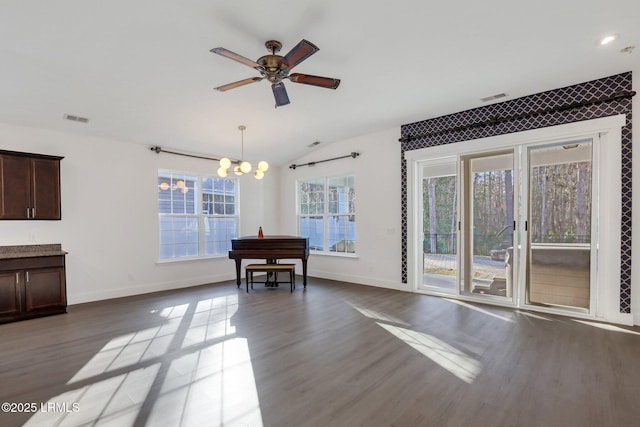 dining room with visible vents, wood finished floors, and vaulted ceiling