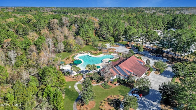 aerial view with a wooded view