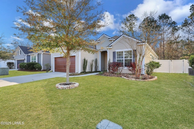 view of front of house with a front yard, an attached garage, fence, and driveway