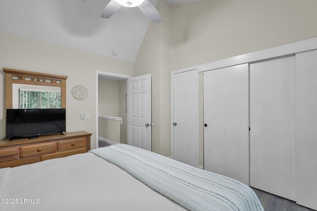 bedroom featuring hardwood / wood-style flooring, ceiling fan, and vaulted ceiling