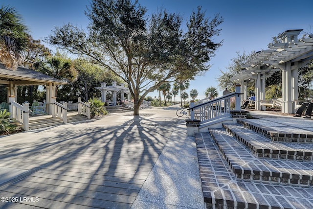 wooden deck featuring a pergola